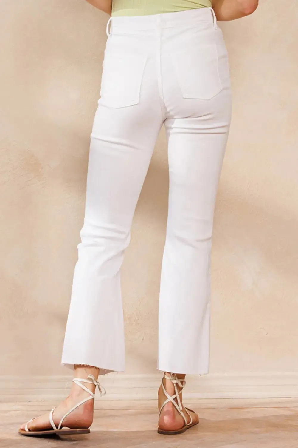 HIGH RISE WHITE CROPPED KICK FLARE WITH RAW CUT HEM