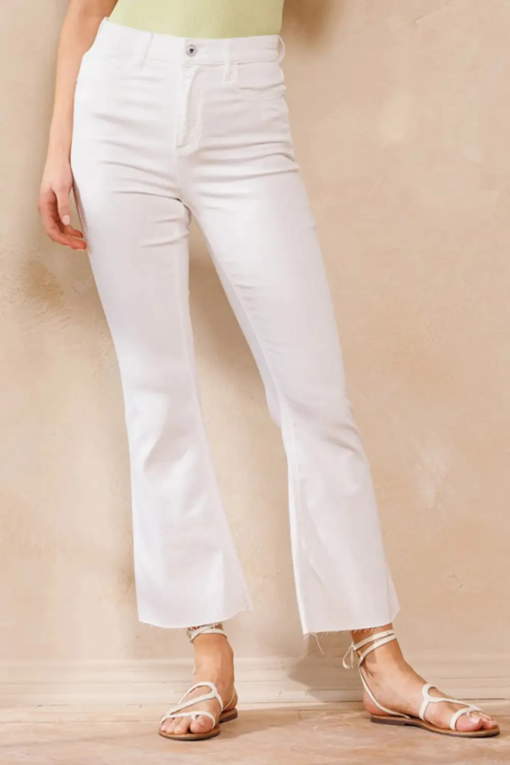 HIGH RISE WHITE CROPPED KICK FLARE WITH RAW CUT HEM